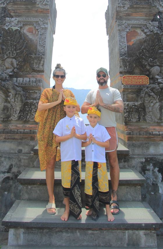 Anna, Andy and the twins Cody and Ryan at a Balinese temple gate